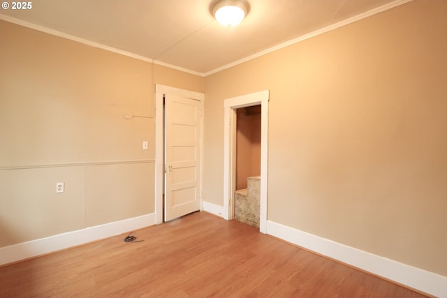 780 N 10th St, Coos Bay, OR 97420 - empty room with light wood-style floors, crown molding, and baseboards