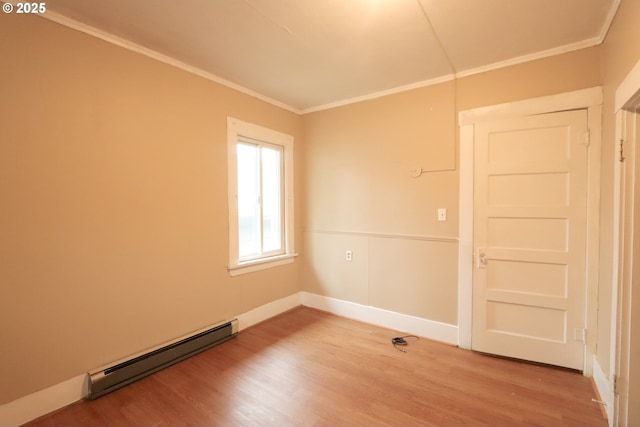 780 N 10th St, Coos Bay, OR 97420 - empty room featuring baseboards, ornamental molding, light wood-style floors, and a baseboard radiator