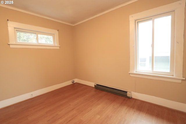 780 N 10th St, Coos Bay, OR 97420 - unfurnished room with light wood-type flooring, crown molding, and a baseboard radiator