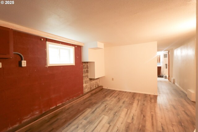 780 N 10th St, Coos Bay, OR 97420 - below grade area featuring a textured ceiling and wood finished floors