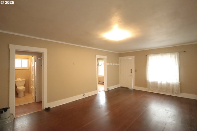 780 N 10th St, Coos Bay, OR 97420 - empty room with crown molding, baseboards, and dark wood-type flooring