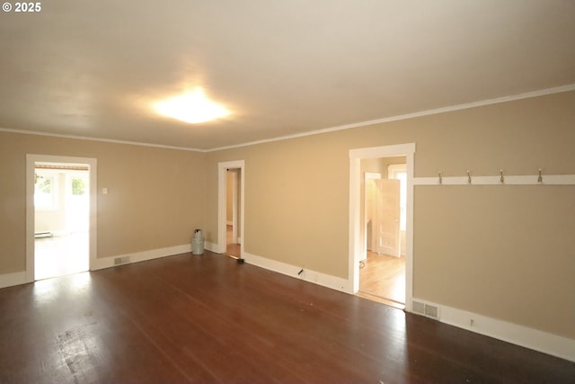 780 N 10th St, Coos Bay, OR 97420 - empty room featuring visible vents, ornamental molding, dark wood-style floors, and baseboards