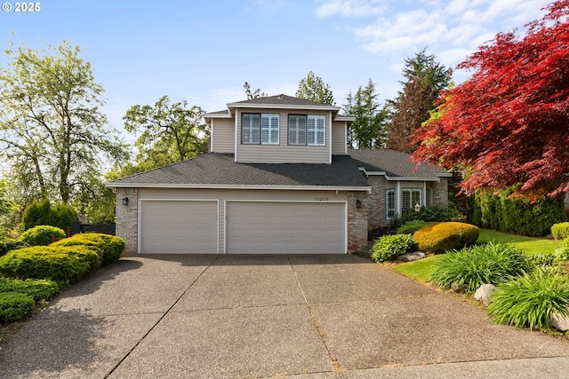 view of front of house featuring roof with shingles, an attached garage, concrete driveway, and brick siding