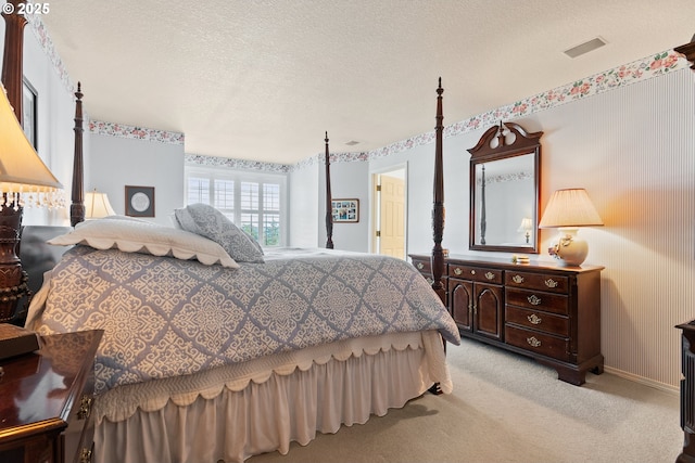 bedroom featuring baseboards and light colored carpet