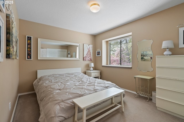 carpeted bedroom featuring baseboards