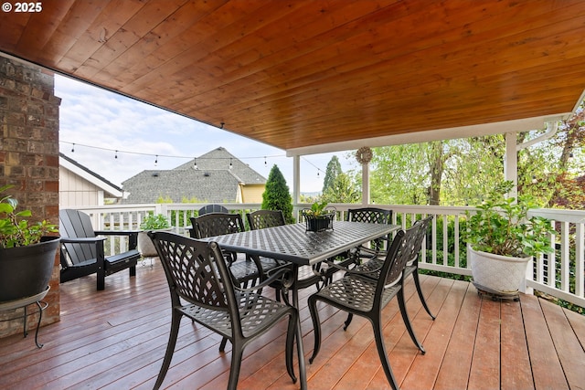 wooden terrace featuring outdoor dining space