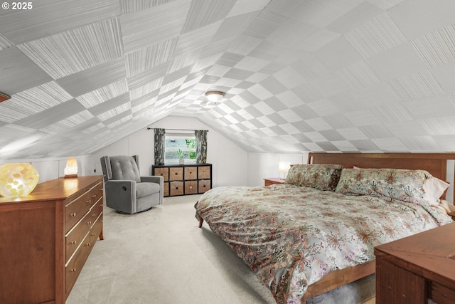 bedroom with light carpet and lofted ceiling
