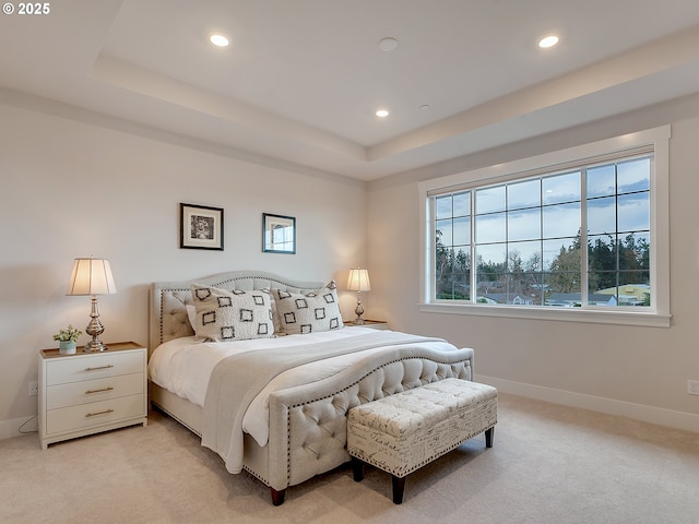 bedroom featuring light carpet, recessed lighting, and multiple windows
