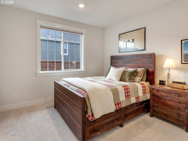 bedroom with carpet floors, baseboards, and multiple windows