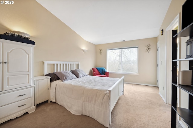 bedroom featuring lofted ceiling and light colored carpet