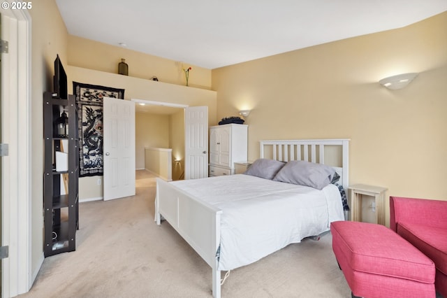 bedroom featuring light carpet