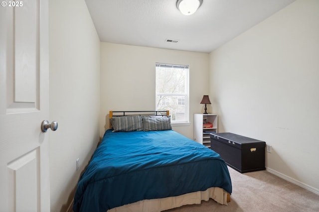 bedroom featuring light colored carpet