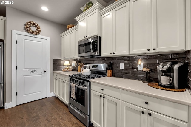 13610 NE 109th Way, Vancouver, WA 98682 - kitchen with stainless steel appliances, tasteful backsplash, white cabinetry, light countertops, and recessed lighting