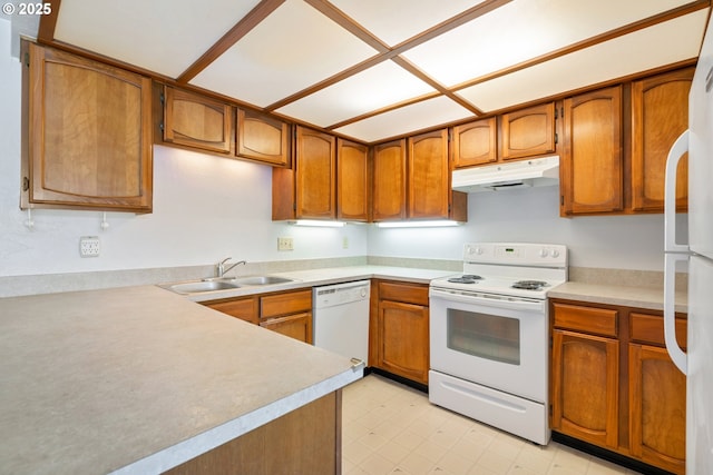 650 Harlow Rd Unit 240, Springfield, OR 97477 - kitchen featuring brown cabinets, under cabinet range hood, a sink, and white appliances