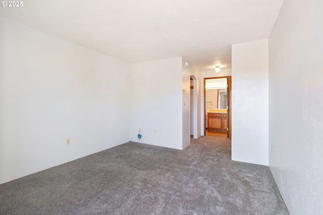 650 Harlow Rd Unit 240, Springfield, OR 97477 - carpeted empty room featuring arched walkways