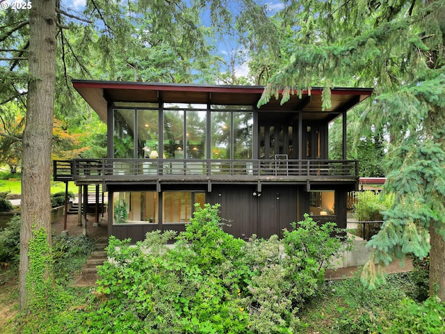 450 Horizon Rd, Eugene, OR 97405 - back of house featuring stairway, a sunroom, and a wooden deck