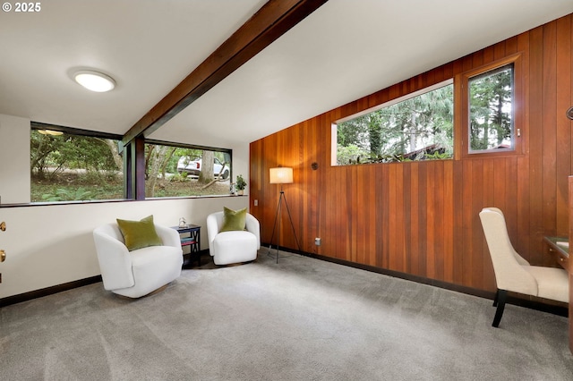 450 Horizon Rd, Eugene, OR 97405 - living area featuring healthy amount of natural light, wooden walls, beamed ceiling, and carpet floors