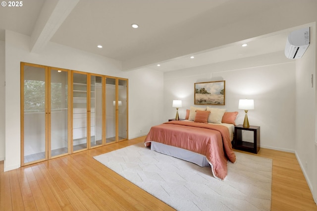 450 Horizon Rd, Eugene, OR 97405 - bedroom featuring a wall mounted AC, beam ceiling, wood finished floors, and recessed lighting