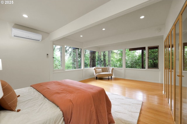 450 Horizon Rd, Eugene, OR 97405 - bedroom featuring an AC wall unit, recessed lighting, and light wood-style floors