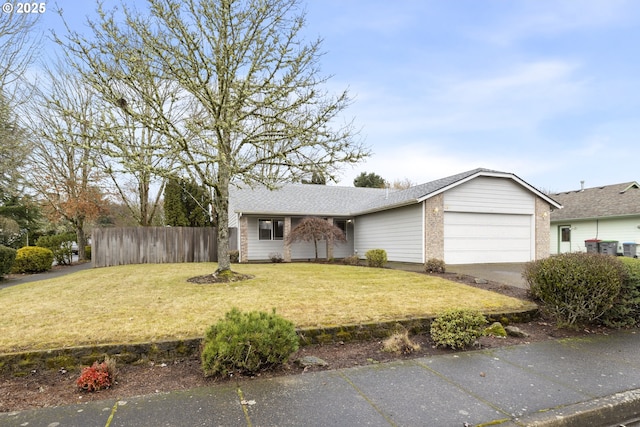 view of front of house featuring a shingled roof, concrete driveway, an attached garage, a front yard, and fence