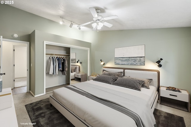 bedroom featuring lofted ceiling, a closet, carpet flooring, ceiling fan, and baseboards