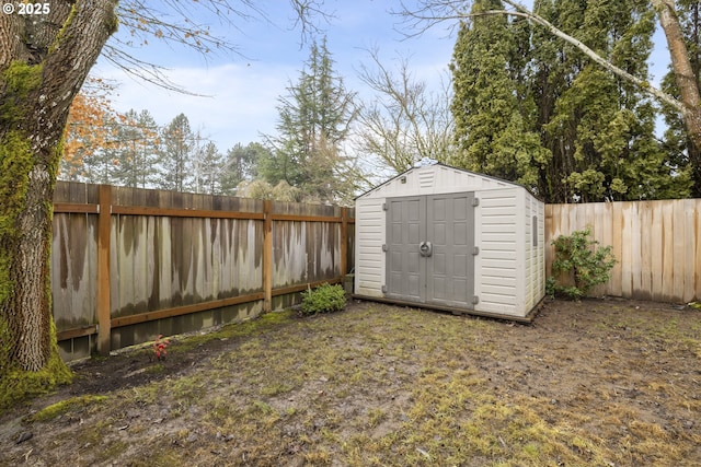 view of shed with a fenced backyard