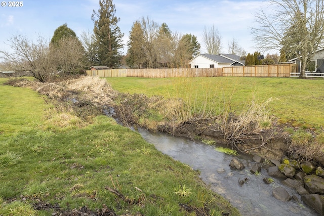 view of yard featuring fence