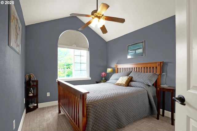 2146 NW Jetty Ave, Lincoln City, OR 97367 - carpeted bedroom with vaulted ceiling, baseboards, and a ceiling fan
