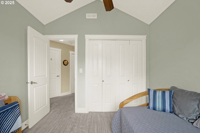 2146 NW Jetty Ave, Lincoln City, OR 97367 - carpeted bedroom with vaulted ceiling, a closet, a ceiling fan, and baseboards