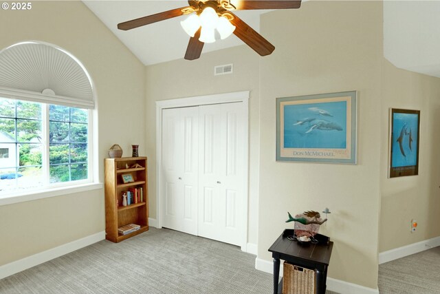 2146 NW Jetty Ave, Lincoln City, OR 97367 - bedroom featuring light colored carpet, lofted ceiling, a closet, baseboards, and a ceiling fan