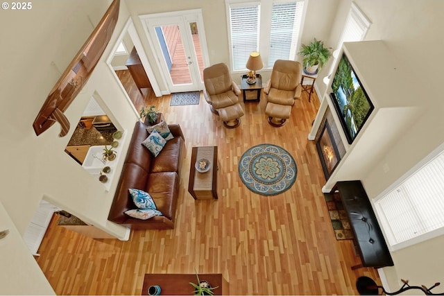 2146 NW Jetty Ave, Lincoln City, OR 97367 - living room featuring wood finished floors, plenty of natural light, and a glass covered fireplace
