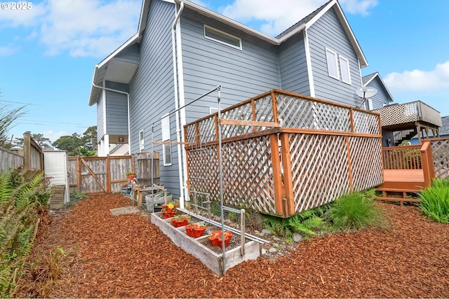 2146 NW Jetty Ave, Lincoln City, OR 97367 - back of property with a wooden deck and fence