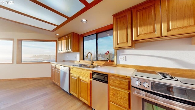 16151 Lower Harbor Rd, Brookings, OR 97415 - kitchen with recessed lighting, light countertops, white dishwasher, a sink, and stainless steel range with electric stovetop