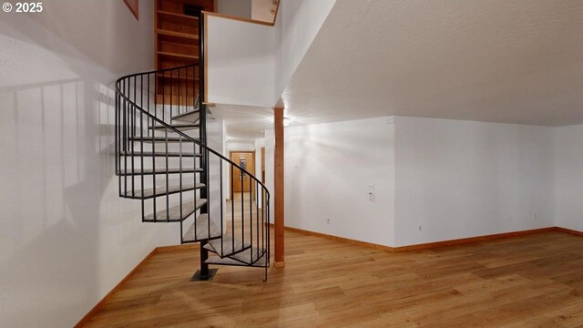 16151 Lower Harbor Rd, Brookings, OR 97415 - staircase featuring wood finished floors and baseboards