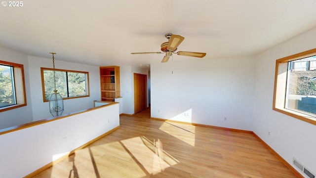 16151 Lower Harbor Rd, Brookings, OR 97415 - spare room featuring baseboards, visible vents, ceiling fan, and light wood-style floors