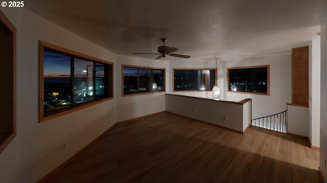 16151 Lower Harbor Rd, Brookings, OR 97415 - interior space with wood finished floors, ceiling fan, and baseboards