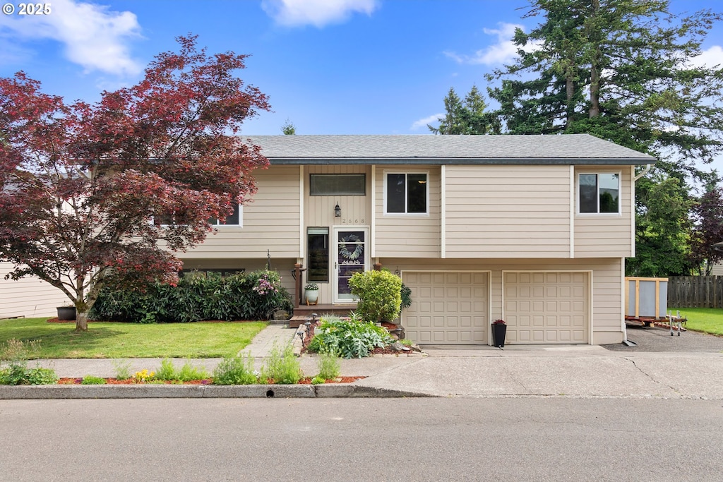 2668 Knox St, West Linn, OR 97068 - bi-level home featuring a garage, driveway, and a front yard