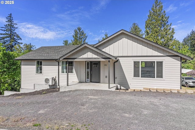 151 Alpha Dr, Longview, WA 98632 - single story home with ac unit, board and batten siding, covered porch, and a shingled roof