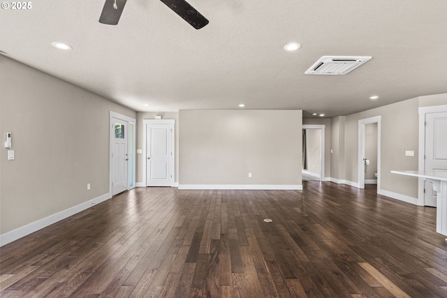 151 Alpha Dr, Longview, WA 98632 - unfurnished living room with a ceiling fan, dark wood-style floors, baseboards, recessed lighting, and a textured ceiling