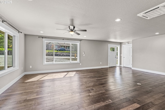 151 Alpha Dr, Longview, WA 98632 - unfurnished living room featuring healthy amount of natural light, a ceiling fan, dark wood finished floors, a textured ceiling, and recessed lighting