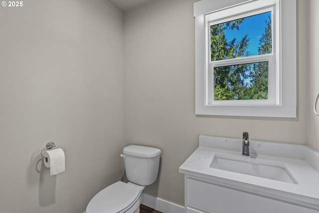 151 Alpha Dr, Longview, WA 98632 - half bathroom featuring toilet, vanity, and baseboards