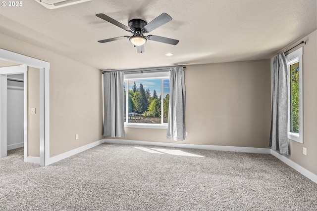 151 Alpha Dr, Longview, WA 98632 - unfurnished bedroom with carpet, a textured ceiling, baseboards, and ceiling fan