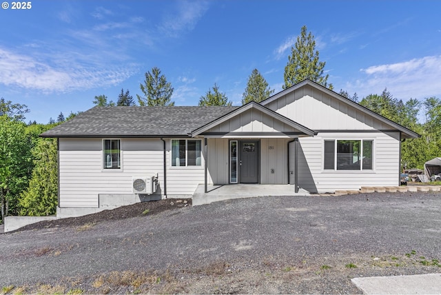 151 Alpha Dr, Longview, WA 98632 - ranch-style home with a cooling unit, a shingled roof, and a porch