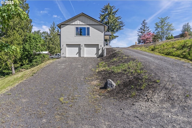 151 Alpha Dr, Longview, WA 98632 - view of front of home with a garage, driveway, and board and batten siding