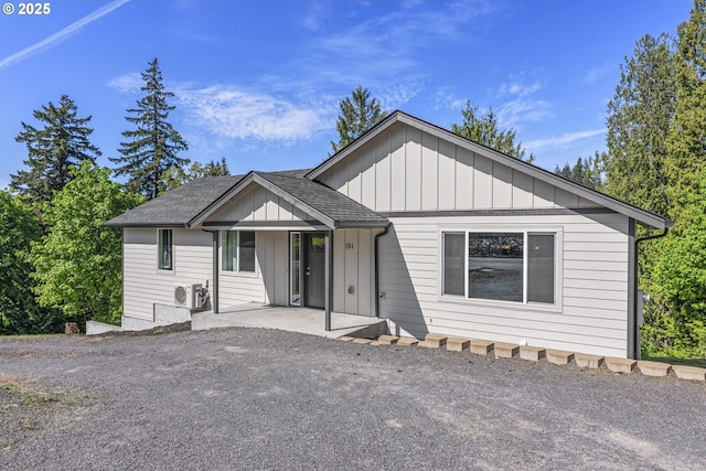 151 Alpha Dr, Longview, WA 98632 - view of front of home featuring board and batten siding, ac unit, and a shingled roof