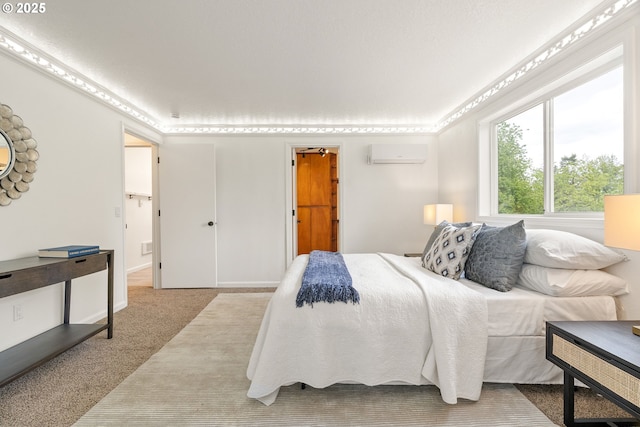 carpeted bedroom with a wall unit AC