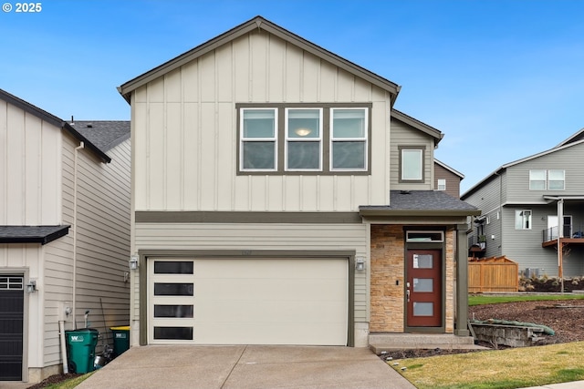 view of front of property with a garage, stone siding, board and batten siding, and driveway