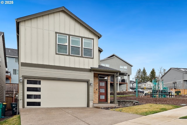 view of front of property with a playground, an attached garage, board and batten siding, and driveway