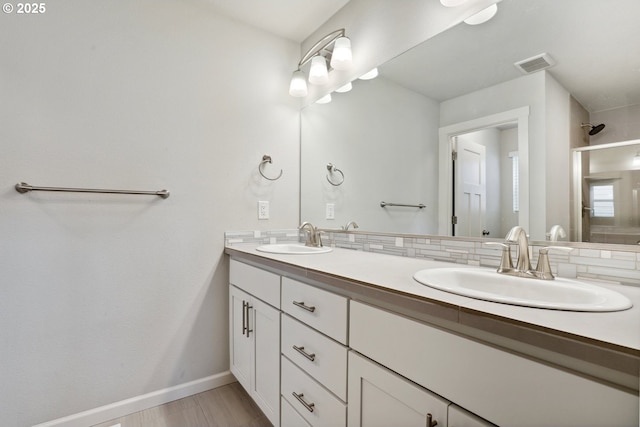 1327 19th Ave, Forest Grove, OR 97116 - full bathroom featuring double vanity, a shower stall, decorative backsplash, and wood finished floors