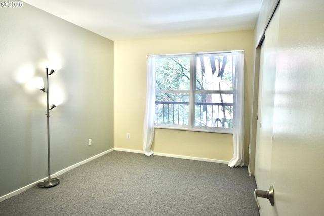 1500 SW Park Ave Unit 206, Portland, OR 97201 - empty room with dark carpet and baseboards